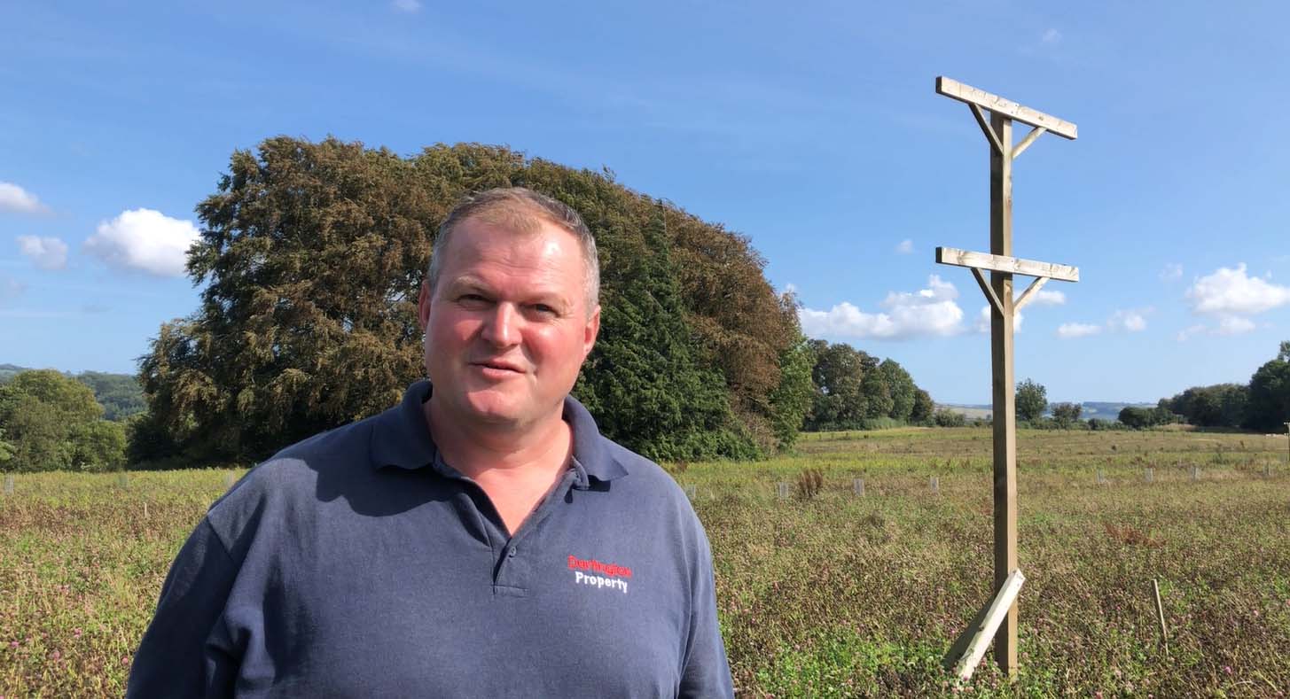 estate warden Mike Newby and a raptor perch