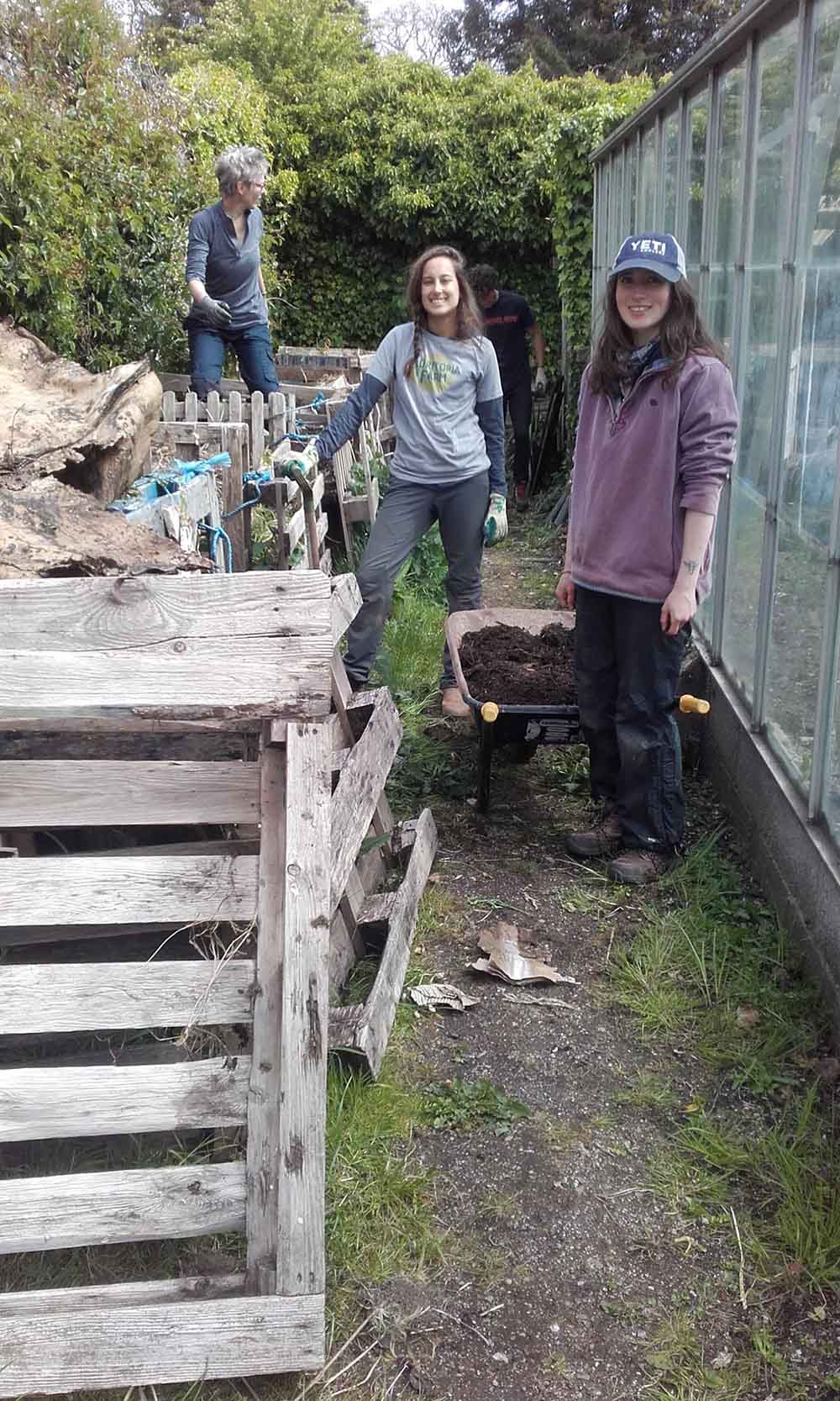 students from Schumacher College sort the compost