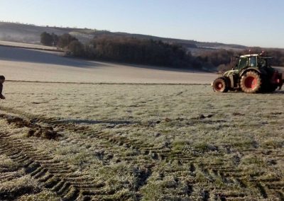 Using a tape measure to check that the tractor's GPS system is getting the distance between rows right (which it was)