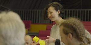An economics student at Schuamcher College engages in a climate fresk event at Dartington