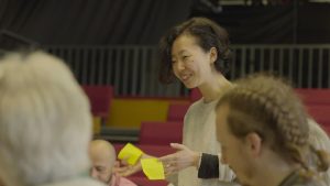 An economics student at Schuamcher College engages in a climate fresk event at Dartington