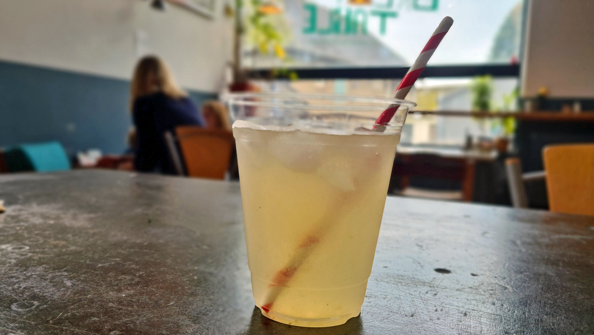 Green Table Lemonade in a compostable glass